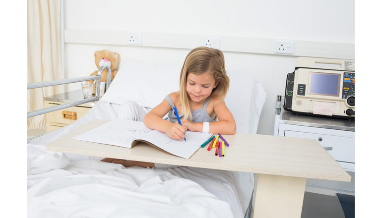 Girl in hospital bed